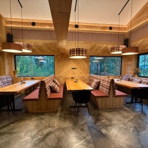 Warm wooden interior with stone accents – a perfect space for intimate gatherings.