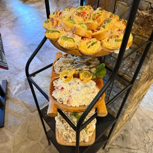 A dessert corner with colorful cakes and fresh fruit – ready for guests to enjoy.